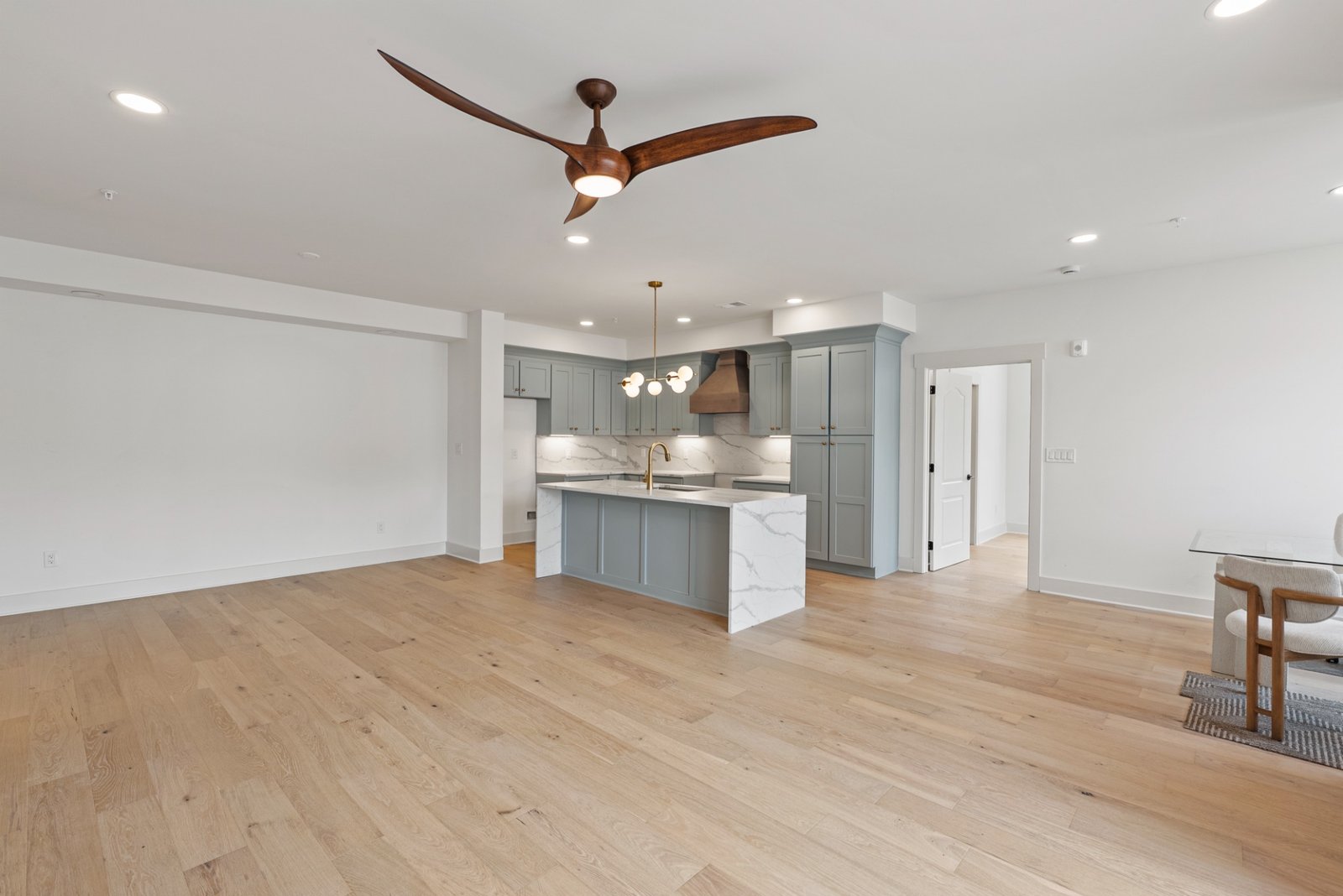 Bright open-concept kitchen and living space at The Enclave